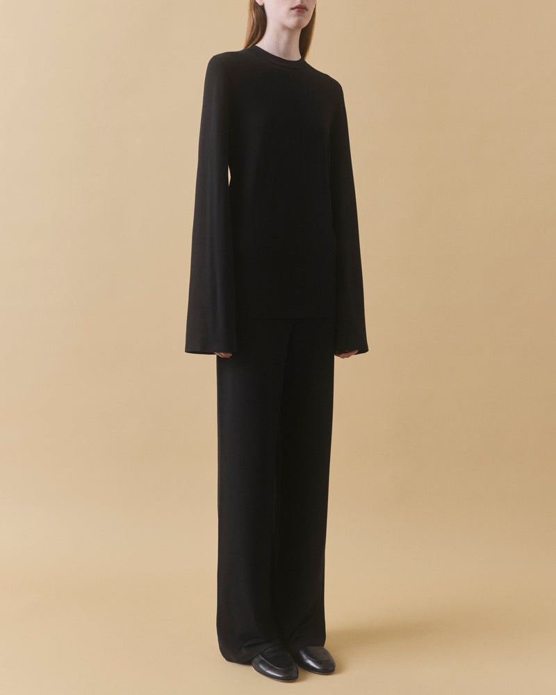 Black fluid viscose long sleeve top, full length styled with black trousers – Dhoemi