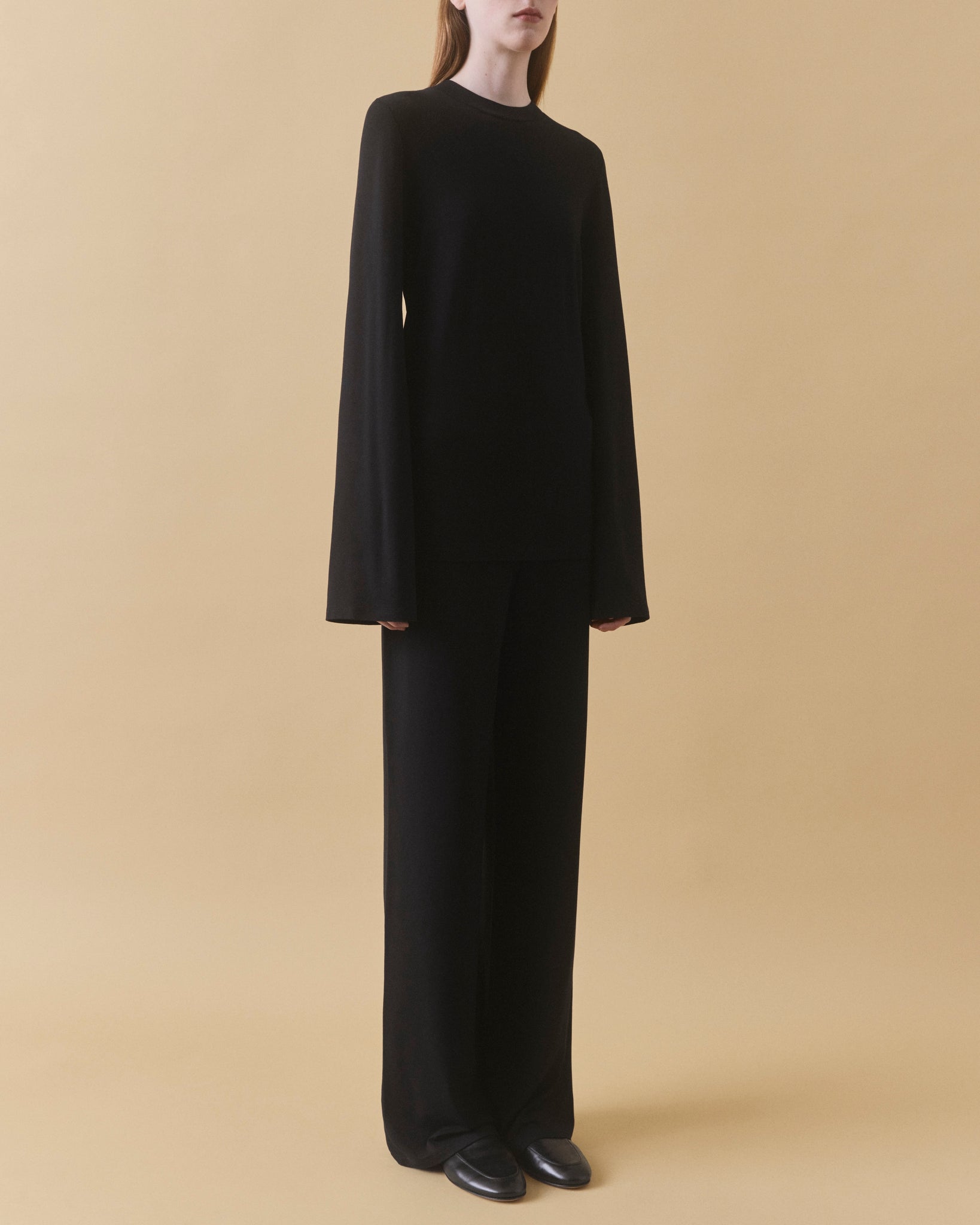 Black fluid viscose long sleeve top, full length styled with black trousers – Dhoemi