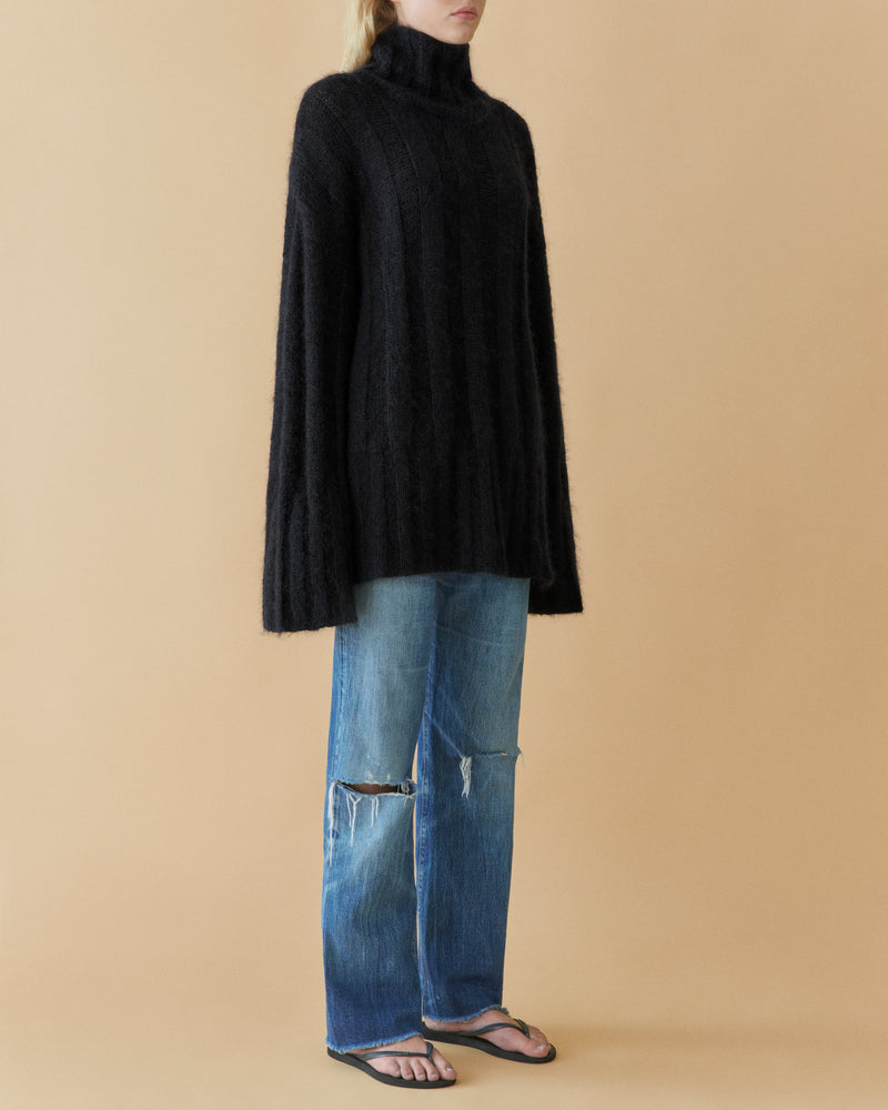 Black voluminous mohair rib knit turtleneck, full length styled with jeans – Dhoemi
