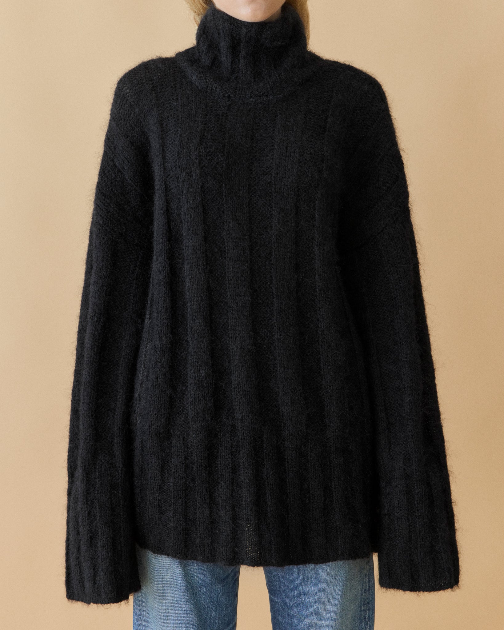 Black oversized mohair rib knit turtleneck with generous sleeves, front view – Dhoemi
